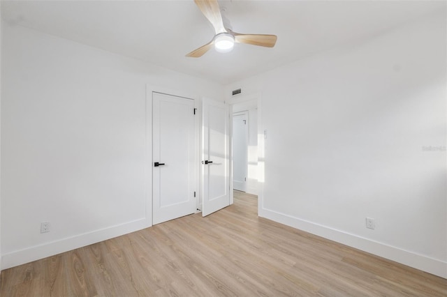 8256 Lark St, Seminole, FL 33777 - spare room featuring light wood-type flooring and ceiling fan