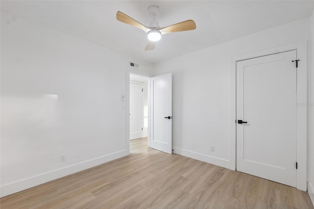 8256 Lark St, Seminole, FL 33777 - unfurnished bedroom with light wood finished floors and ceiling fan