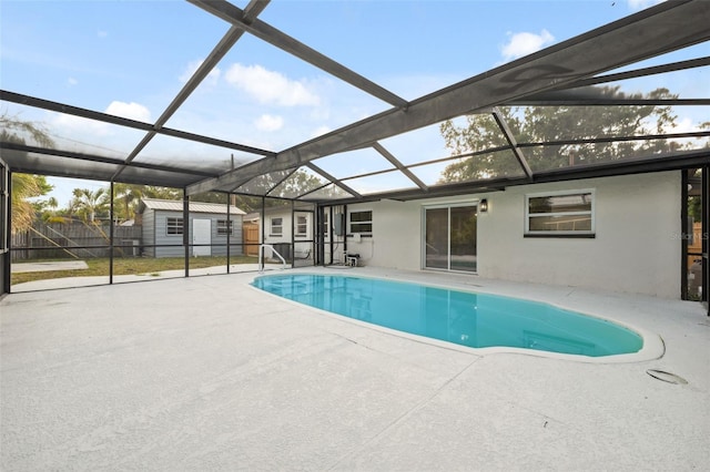 8256 Lark St, Seminole, FL 33777 - view of pool featuring a storage unit, a patio area, and glass enclosure
