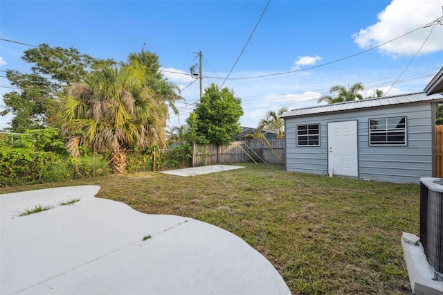 8256 Lark St, Seminole, FL 33777 - fenced backyard with a patio area and an outdoor structure