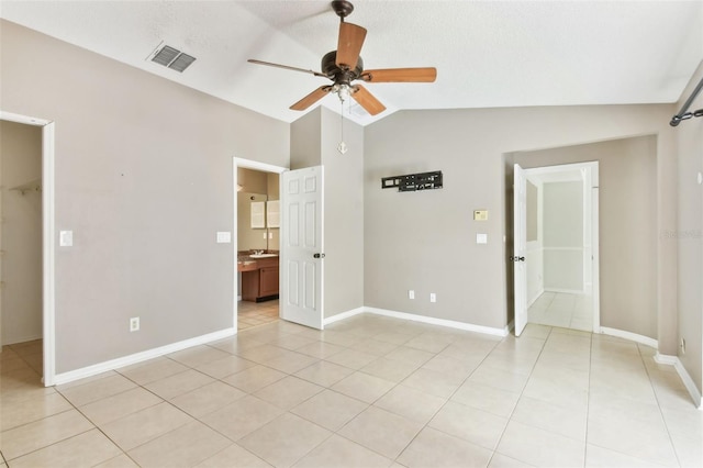 11304 Plumtree Ct, Riverview, FL 33579 - unfurnished bedroom with lofted ceiling, light tile patterned flooring, a spacious closet, connected bathroom, and ceiling fan