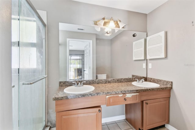 11304 Plumtree Ct, Riverview, FL 33579 - bathroom with double vanity, a shower stall, and tile patterned flooring