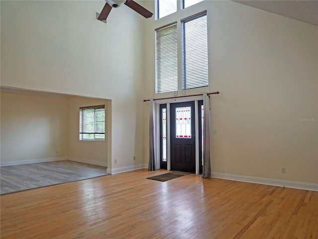 8759 Orient Way NE, Saint Petersburg, FL 33702 - entrance foyer featuring high vaulted ceiling, a ceiling fan, and light wood-type flooring