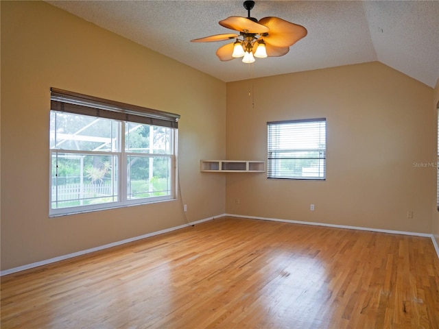 8759 Orient Way NE, Saint Petersburg, FL 33702 - unfurnished room with a ceiling fan, light wood-style flooring, a textured ceiling, and vaulted ceiling