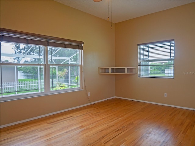 8759 Orient Way NE, Saint Petersburg, FL 33702 - unfurnished room with light wood finished floors and healthy amount of natural light