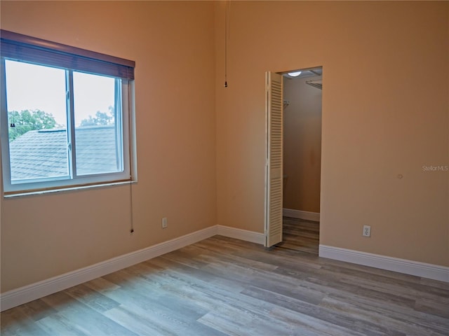 8759 Orient Way NE, Saint Petersburg, FL 33702 - spare room featuring wood finished floors