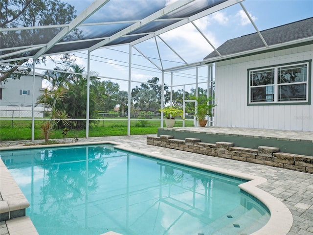 8759 Orient Way NE, Saint Petersburg, FL 33702 - outdoor pool featuring a patio and glass enclosure