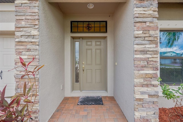 18125 Roseate Dr, Lutz, FL 33558 - entrance to property with stucco siding and stone siding