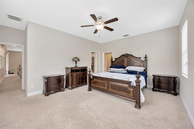 18125 Roseate Dr, Lutz, FL 33558 - bedroom with light colored carpet and ceiling fan