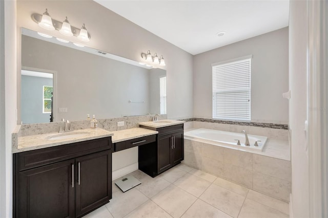 18125 Roseate Dr, Lutz, FL 33558 - full bathroom with double vanity, a garden tub, and tile patterned flooring