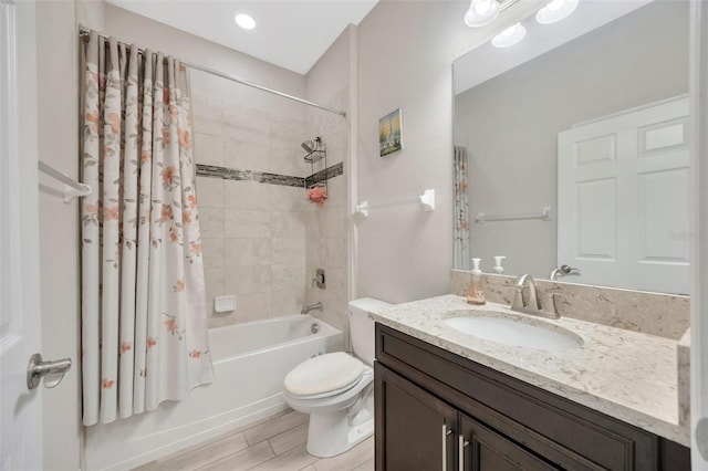 18125 Roseate Dr, Lutz, FL 33558 - full bathroom featuring vanity, shower / bath combination with curtain, and wood finished floors