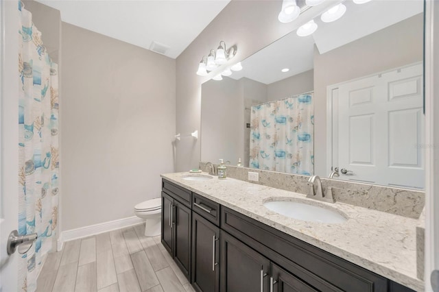 18125 Roseate Dr, Lutz, FL 33558 - bathroom featuring double vanity and a shower with shower curtain