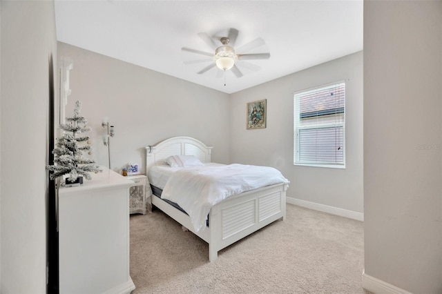 18125 Roseate Dr, Lutz, FL 33558 - bedroom with light colored carpet and ceiling fan
