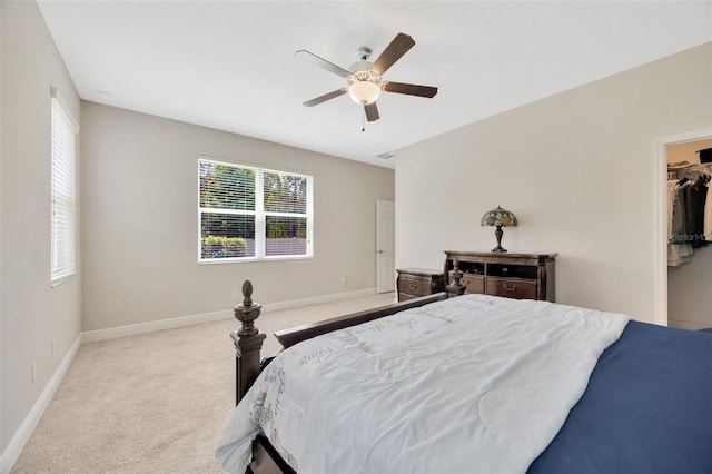 18125 Roseate Dr, Lutz, FL 33558 - bedroom featuring carpet, a ceiling fan, and a walk in closet