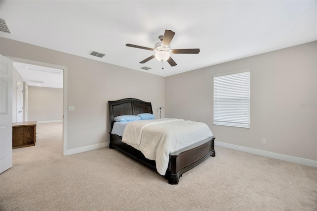 18125 Roseate Dr, Lutz, FL 33558 - bedroom with light colored carpet and ceiling fan