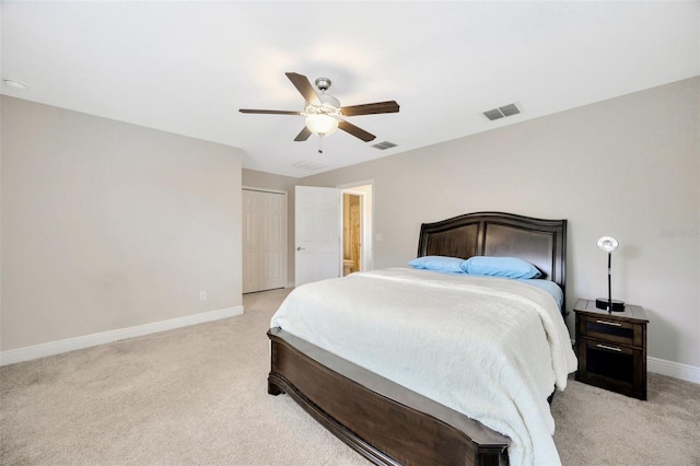 18125 Roseate Dr, Lutz, FL 33558 - bedroom with light carpet, ceiling fan, and a closet