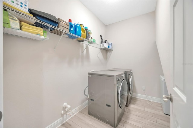 18125 Roseate Dr, Lutz, FL 33558 - washroom featuring washing machine and dryer and wood tiled floors