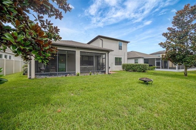 18125 Roseate Dr, Lutz, FL 33558 - back of house featuring a sunroom and stucco siding