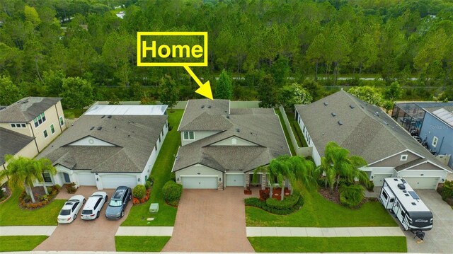 18125 Roseate Dr, Lutz, FL 33558 - aerial view of residential area featuring a heavily wooded area