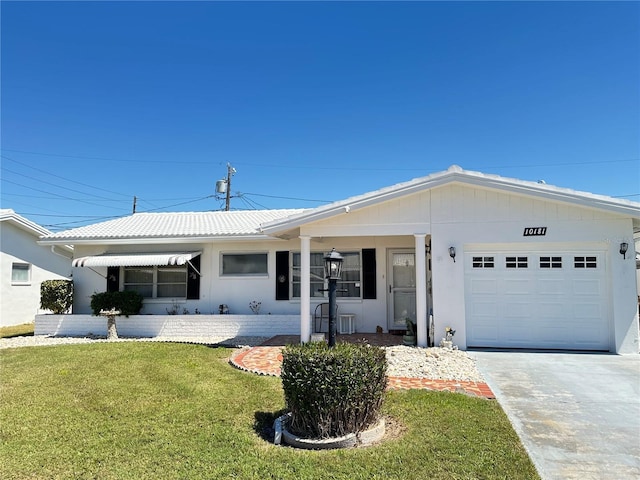 10181 44th Way N Unit 2, Pinellas Park, FL 33782 - ranch-style home featuring a front lawn, an attached garage, and driveway