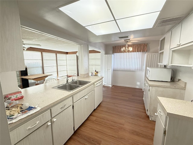 10181 44th Way N Unit 2, Pinellas Park, FL 33782 - kitchen with white appliances, light countertops, wood finished floors, a chandelier, and open shelves