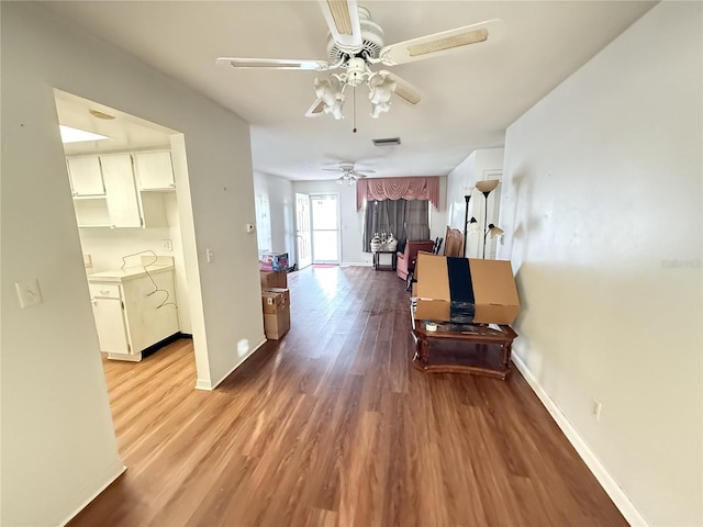10181 44th Way N Unit 2, Pinellas Park, FL 33782 - hall featuring wood finished floors and baseboards