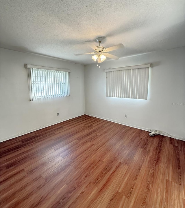 10181 44th Way N Unit 2, Pinellas Park, FL 33782 - empty room featuring wood finished floors, ceiling fan, and a textured ceiling