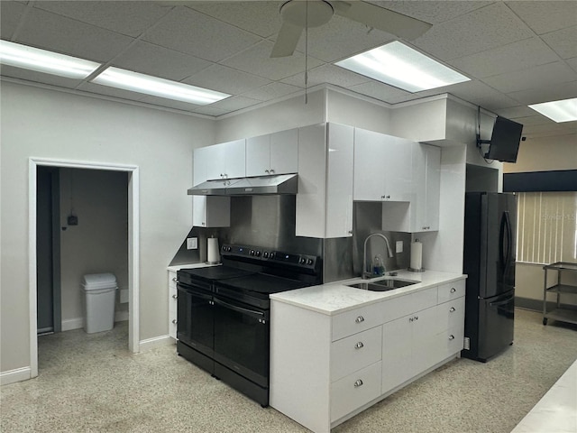 10181 44th Way N Unit 2, Pinellas Park, FL 33782 - kitchen with black appliances, under cabinet range hood, light countertops, a paneled ceiling, and white cabinetry