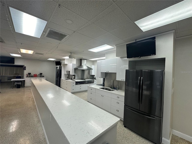 10181 44th Way N Unit 2, Pinellas Park, FL 33782 - kitchen featuring freestanding refrigerator, wall chimney exhaust hood, white cabinets, modern cabinets, and light countertops