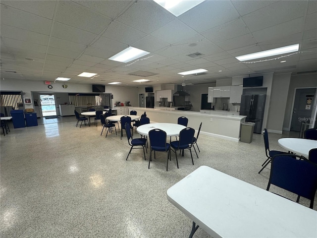 10181 44th Way N Unit 2, Pinellas Park, FL 33782 - dining space featuring a drop ceiling and dark speckled floor