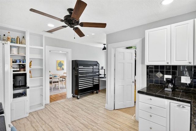 4820 8th Ave S, Saint Petersburg, FL 33711 - kitchen featuring white cabinets, ceiling fan, tasteful backsplash, and recessed lighting