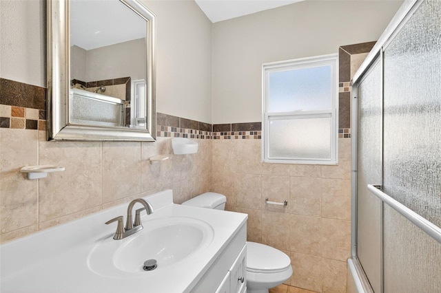 4820 8th Ave S, Saint Petersburg, FL 33711 - full bath with tile walls, a shower with door, vanity, and a wainscoted wall