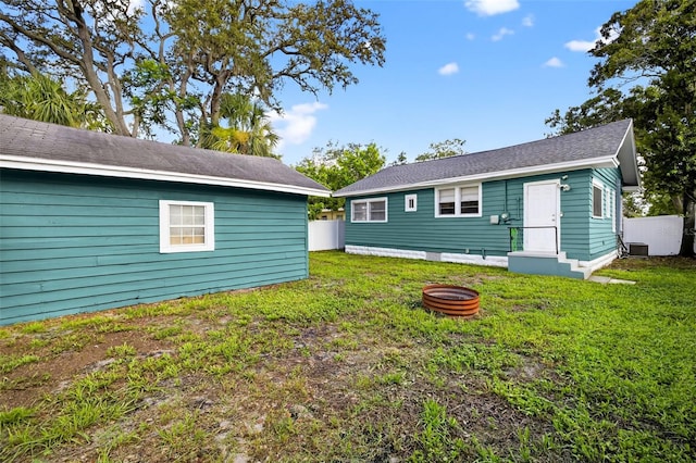 4820 8th Ave S, Saint Petersburg, FL 33711 - back of property featuring a yard and an outdoor fire pit