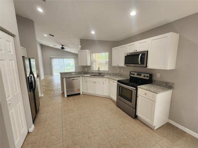 3407 E Comanche Ave, Tampa, FL 33610 - kitchen featuring stainless steel appliances, white cabinetry, light stone counters, recessed lighting, and ceiling fan