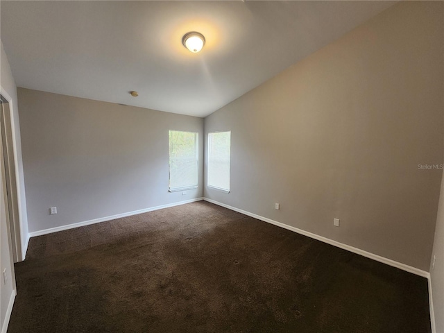3407 E Comanche Ave, Tampa, FL 33610 - unfurnished room with dark carpet and lofted ceiling