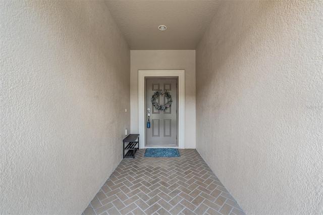 12039 Greengate Dr, Hudson, FL 34669 - doorway to property with stucco siding