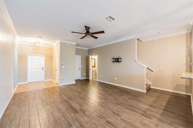12039 Greengate Dr, Hudson, FL 34669 - unfurnished living room with wood finished floors, ceiling fan, ornamental molding, and stairs