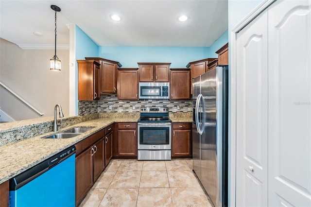 12039 Greengate Dr, Hudson, FL 34669 - kitchen with stainless steel appliances, light stone countertops, backsplash, hanging light fixtures, and recessed lighting