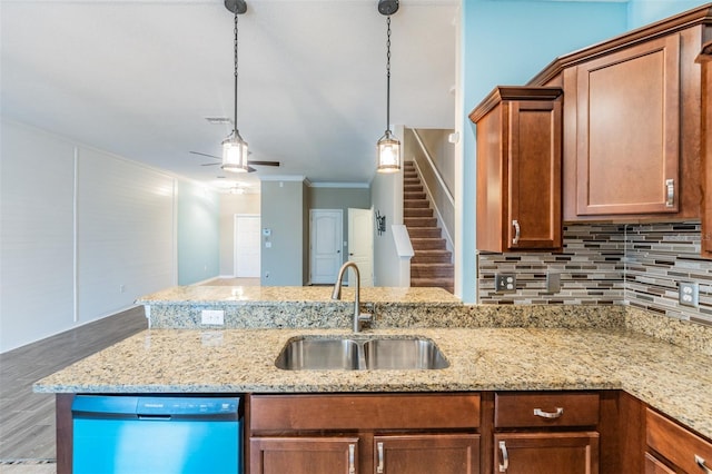12039 Greengate Dr, Hudson, FL 34669 - kitchen with dishwasher, tasteful backsplash, light stone countertops, ceiling fan, and decorative light fixtures