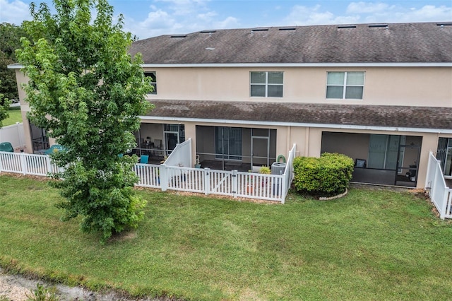 12039 Greengate Dr, Hudson, FL 34669 - back of property with a shingled roof, a sunroom, and stucco siding
