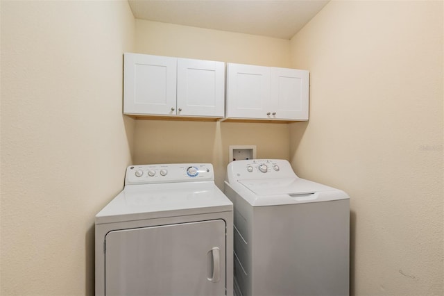 12039 Greengate Dr, Hudson, FL 34669 - laundry area with cabinet space and separate washer and dryer