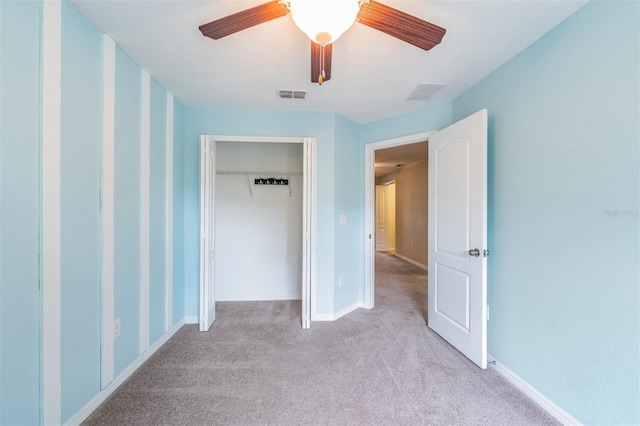 12039 Greengate Dr, Hudson, FL 34669 - unfurnished bedroom featuring light colored carpet, a closet, and ceiling fan