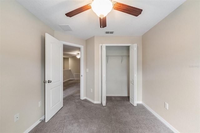 12039 Greengate Dr, Hudson, FL 34669 - unfurnished bedroom with carpet, a closet, and a ceiling fan