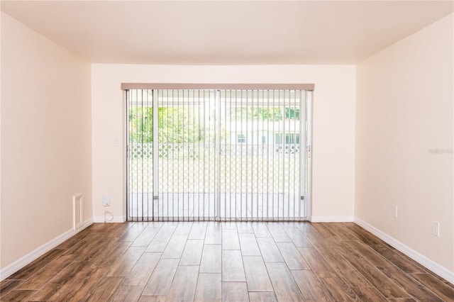 3406 Rock Royal Dr, Holiday, FL 34691 - unfurnished room with wood finished floors and plenty of natural light