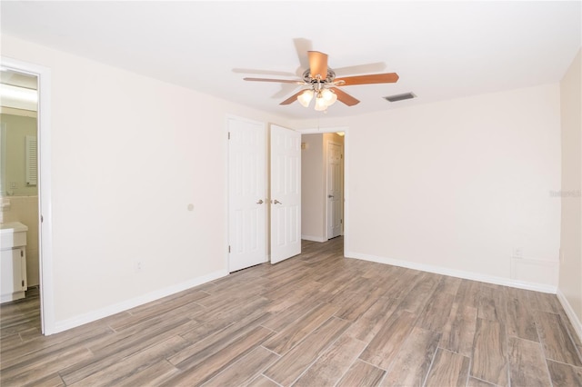 3406 Rock Royal Dr, Holiday, FL 34691 - empty room with light wood-style flooring and ceiling fan