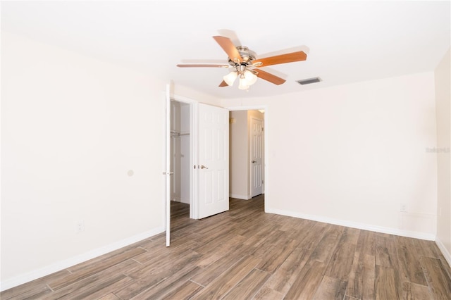 3406 Rock Royal Dr, Holiday, FL 34691 - spare room with wood finished floors and ceiling fan