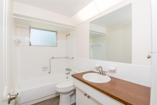 3406 Rock Royal Dr, Holiday, FL 34691 - full bathroom featuring bathing tub / shower combination, vanity, and tile walls