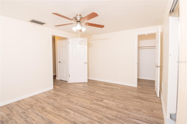 3406 Rock Royal Dr, Holiday, FL 34691 - unfurnished bedroom featuring light wood finished floors and a ceiling fan