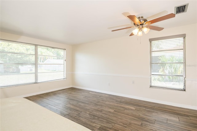 3406 Rock Royal Dr, Holiday, FL 34691 - spare room with a ceiling fan, plenty of natural light, and wood finished floors