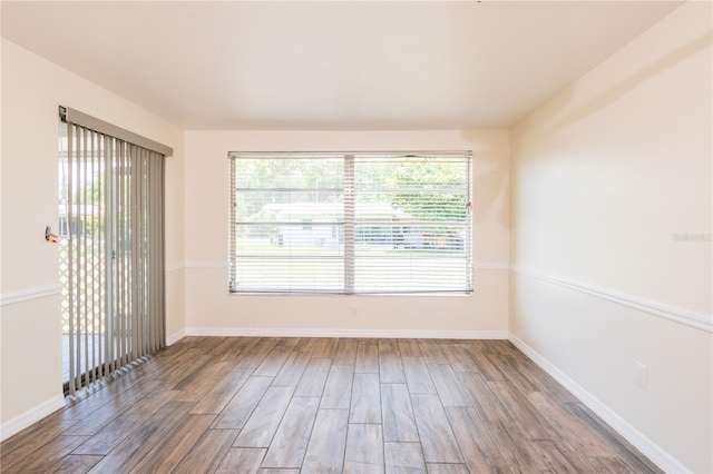 3406 Rock Royal Dr, Holiday, FL 34691 - unfurnished room featuring wood finished floors and healthy amount of natural light